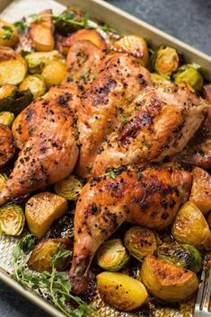 roasted chicken and brussel sprouts in a pan