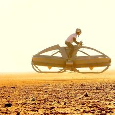 a man flying through the air on top of a large object in an open field