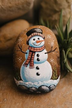 Looking for Christmas Rock Painting Ideas? Transform your home this holiday season with these DIY projects. From simple to intricate designs, there's something for everyone to enjoy! Rock Art Painting Ideas, Winter Painted Rocks Ideas, Winter Rock Painting Ideas, Christmas Stone Painting, Painting Ideas For Home Decor, Painting Ideas For Home, Snowmen Art, Stone Painting Ideas, Christmas Rock Painting Ideas