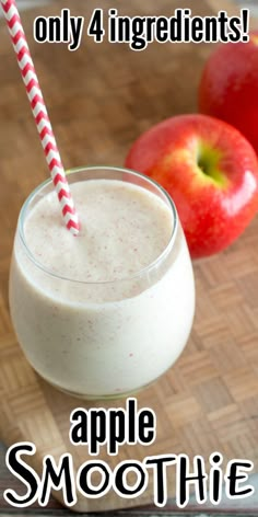 an apple smoothie in a glass next to two apples