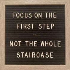 a sign that says focus on the first step not the whole staircase