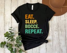 FREE SHIPPING Embrace your passion for bocce and showcase your dedication with our bocce Shirt. Order yours today and take your bocce style to the next level! PURCHASING Because this sweatshirt is made to order there are no refunds or returns. Please double check size and color before checking out. If you have any questions please do not hesitate to message me!  MATERIAL: -100% Airlume combed and ringspun cotton (fiber content may vary for different colors) -Light fabric (4.2 oz/yd² (142 g/m -Retail fit -Tear away label -Runs true to size **Size up if you want a bigger fit** SIZING:  Unisex Heavy Blend Adult Crewneck Shirt Bella 3001  *Go a size up if you are wanting a larger fit* SHIPPING: 2-7 days depending on where you are located in the US.        CARE INSTRUCTIONS: Non-chlorine: bleac Balls Shirt, Team Shirt, Coach Gifts, Team Shirts, Crew Neck Shirt, Funny T Shirt, Cotton Fiber, Custom Tshirts, Funny Tshirts