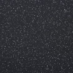 black and white photograph of snow flakes in the night sky, taken from above