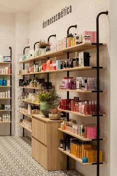 the inside of a store with shelves filled with cosmetics and personal care products on display