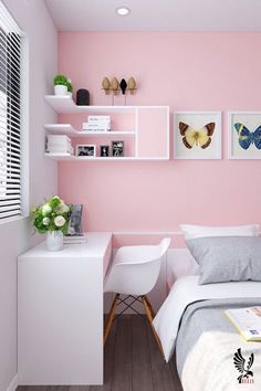 a bedroom with pink walls, white furniture and pictures on the wall above the bed