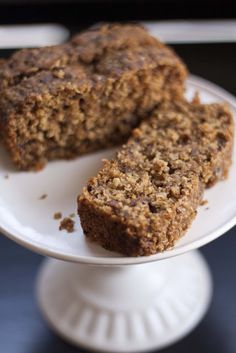 two pieces of banana bread on a white plate