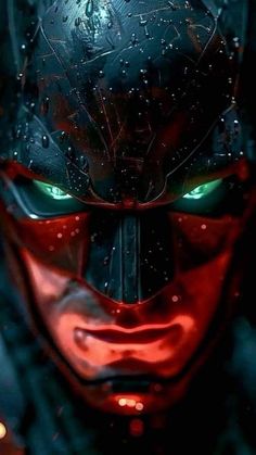 a close up of the face of a batman character with green eyes and red makeup