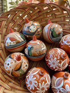 a wicker basket filled with painted eggs