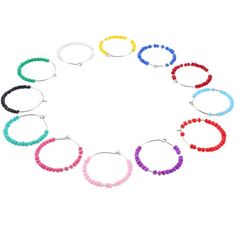 the multicolored beaded hoop earrings are arranged in a circle