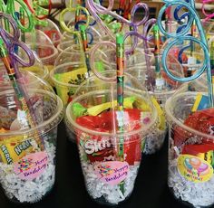 plastic cups filled with lots of different colored items