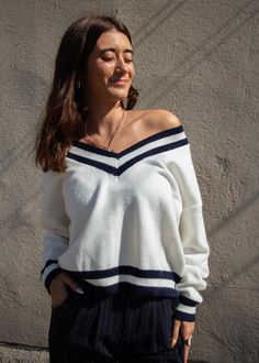 Perfectly preppy! This simple but stunning sweater has a navy varsity stripe that we're all obsessed with right now. You can wear it off shoulder or as the classic v. both are stunning! Comes in ivory & navy. Tennis Sweater, Wear It, Sweater Top, Sweaters & Cardigans, Right Now, Off Shoulder, Tennis, Shopping Outfit, Navy