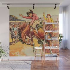 a mural on the side of a wall depicting cowboys riding horses