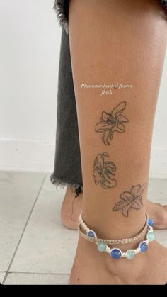 a woman's foot with tattoos on her left leg and the words, i love you