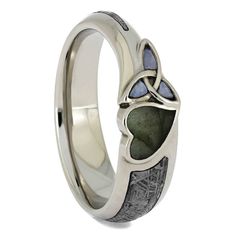 It would be difficult to find another labradorite ring with a design as creative and unique as this one! A fantastic meteorite inlay curls around the sleek 10k white gold band. Of course the stars of the engagement ring are the wonderful fashioned heart and trinity knot, made with labradorite and opal respectively.From one customers design idea to a beautiful ring reality! If you can dream it we can create it.RING LAYOUT - Labradorite Ring with Opal Trinity Knot & Meteorite in 10k White Gold Meteorite Engagement Ring, Labradorite Engagement Ring, Gibeon Meteorite, Meteorite Jewelry, Trinity Ring, Meteorite Ring, Trinity Knot, Engagement Ring Sizes, Labradorite Ring