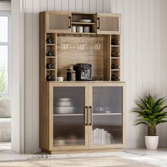 a wooden cabinet with glass doors in a living room next to a potted plant