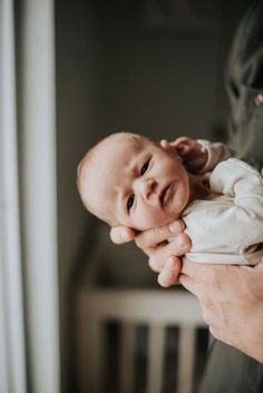 a person holding a baby in their arms