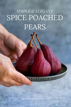 someone holding a plate with three pears on it and the words, simple & elegant spice poached pears