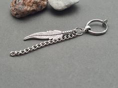 One clip-on men dangle, guys dangle, feather earring men, silver father men, feather earring, men symbol earring, amulet for men, talisman dangle, amulet earring for men, boyfriend gift Silver feather earring with chain and clip-on hook. Silver feather earring total length 2.4 Inches ( 6.2cm ) Feather drop length 1.3 Inches ( 3.2cm ) One silver feather earring with clip on hook. EAR DON'T HAVE TO BE PIERCED. Feathers are a reminder to count our blessings and be thankful for the good stuff going Dangling Earrings For Men, Dangly Mens Earrings, Male Dangle Earrings, Men Symbol, Dangly Earrings Men Feather, Adjustable Silver Feather Earrings, Earring For Men, Feather Earrings Silver, Silver Feather