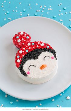 a cake decorated like a penguin on a plate