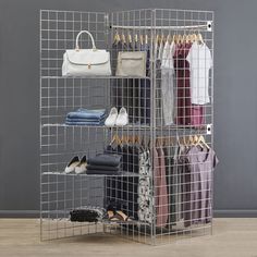 a metal rack holding several pairs of shoes and purses