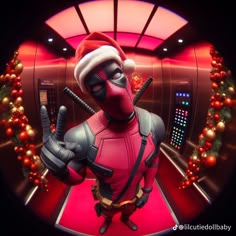 a man dressed as deadpool wearing a santa hat