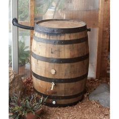 an old wooden barrel sitting in front of a window