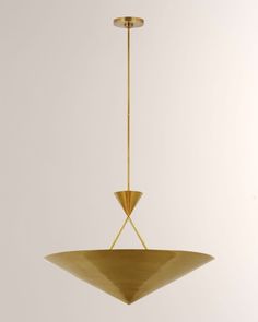 a gold colored pendant light hanging from a ceiling fixture with an inverted cone design on the bottom