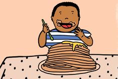 a child eating pancakes with a fork and knife in front of him on a table