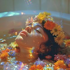 a woman in a bathtub with flowers floating around her head and eyes, looking up at the sky