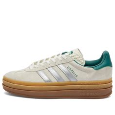 Find ADIDAS Gazelle Bold W on Editorialist. The adidas Gazelle Bold sneakers serve up a triple-stacked portion of style with a fresh new look. Characterised by its tri-layered sole, it features smooth suede on the upper, accented with collegiate green throughout. The iconic 3-Stripes take on a silvery shine, rounding off this bold and eye-grabbing pair. Suede Upper, Lace Closure, Rubber Sole, Adidas. Adidas Women's Gazelle Bold W in Off White/Silver Met/Collegiate Green, Size UK 7 Adidas Bold, Adidas Gazelle Bold, 2020 Outfits, Gazelle Bold, Xmas 2024, Hail Mary, Shoe Gifts, Adidas Gazelle, Dream Shoes