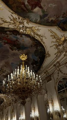 a chandelier hanging from the ceiling in a fancy room