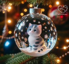 a glass ornament with a cat inside