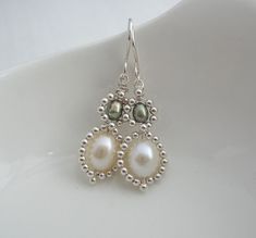 the earrings are made with pearls and beads