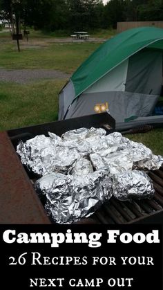 a grill with food on it and the words camping food written in front of it