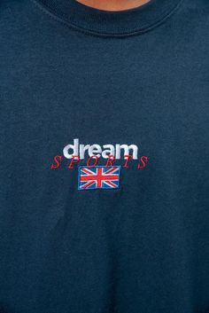 Our much loved Dream Sport embroidery makes a re-appearance, This time on our new Navy garments!! 'Dream Sport' embroidery on the front Woven label details at bottom of t-shirt and inside the collar Relaxed fit, 100% soft cotton Unisex t-shirt Model is wearing a size XL. Model is 6ft3". We use industry standard garments so recommend ordering the size you would normally wear. If you are between sizes then size up For women we recommend ordering the following sizes for a fitted shape: 6/8- small, 10- medium, 12- large, 14- x-large. If you would like an oversized fit we recommend ordering one or two sizes up depending on how oversized you'd like your t-shirt to be. Free stickers included in every order We have a 30 day no hassle return policy Although we aim to ship all orders the same or nex Sporty T-shirt With Embroidered Logo, Sporty Cotton T-shirt With Embroidered Text, Blue Embroidered Graphics T-shirt, Cotton T-shirt With Embroidered Logo For Sports, Blue Relaxed Fit T-shirt With Embroidered Logo, T Shirt Model, Shirt Model, Woven Label, Woven Labels