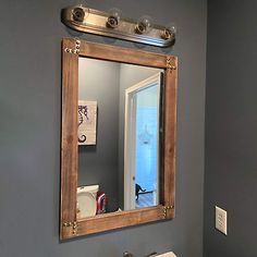 a bathroom sink with a mirror above it