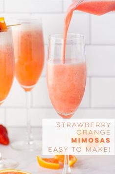 strawberry orange mimosa being poured into wine glasses