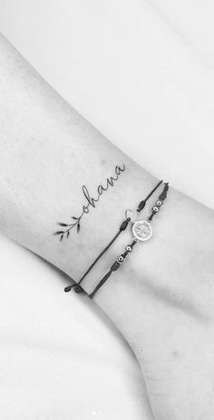 a woman's arm with a tattoo on it and the word mama written in cursive writing