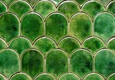 an image of green tiles that look like waves