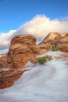 the desert is covered in snow and rocks