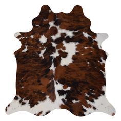 a brown and white cowhide rug on a white background