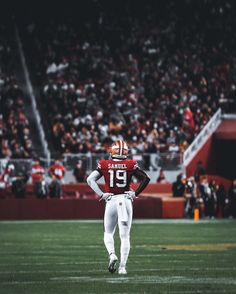 a football player is standing on the field