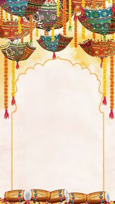 an ornate frame with hanging decorations on the sides and a blank space in the middle