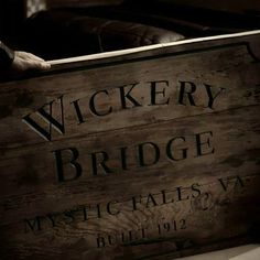 there is a wooden sign that says wickery bridge