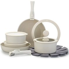 an assortment of white dishes and utensils