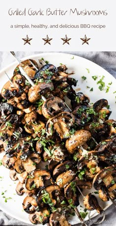 grilled garlic butter mushrooms on a white plate