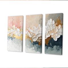 three paintings on the wall with flowers painted on them