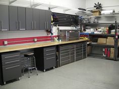 a garage with lots of drawers and cabinets