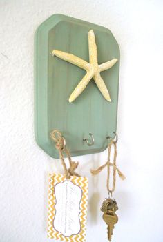 there is a starfish on the wall and some keys