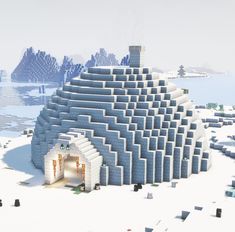 a large building made out of blocks in the snow